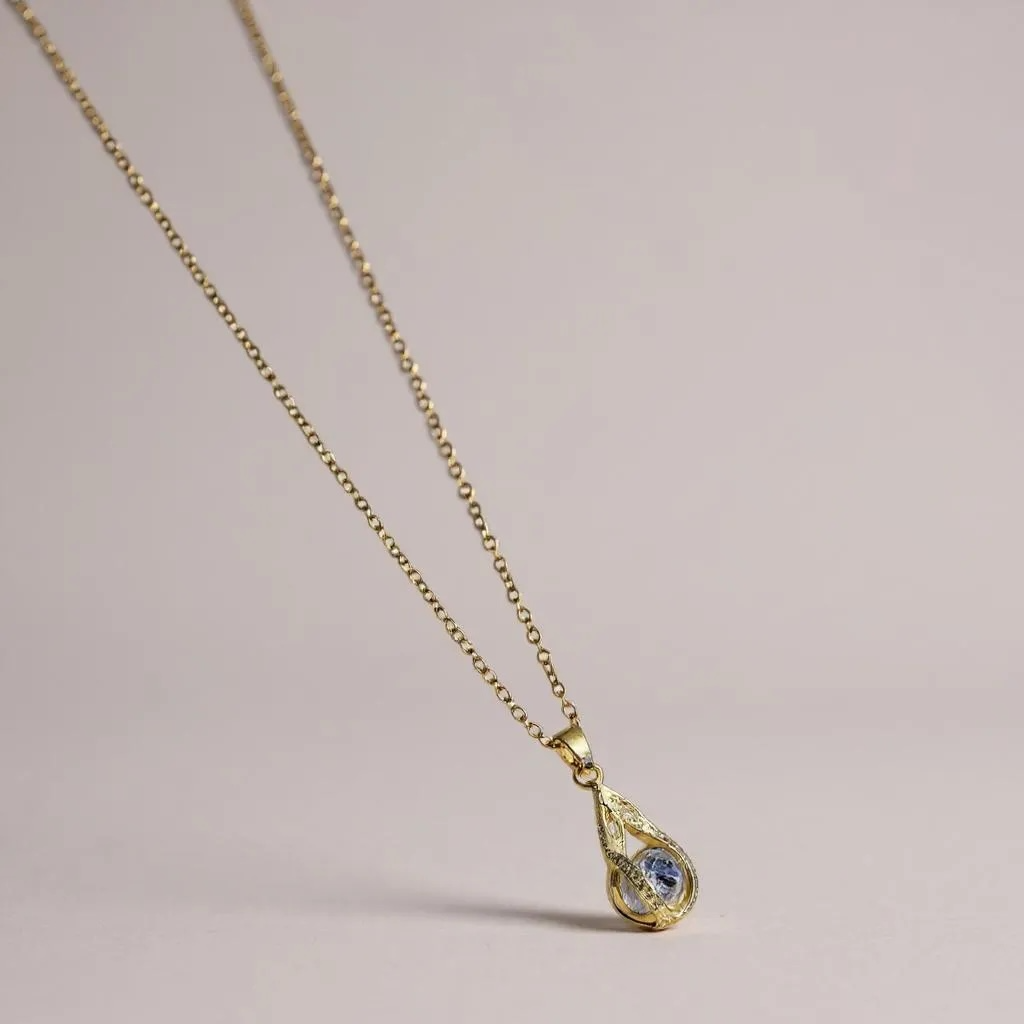 Golden Teardrop Crystal Necklace – Elegant Blue Accent