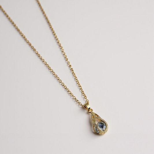 Golden Teardrop Crystal Necklace – Elegant Blue Accent